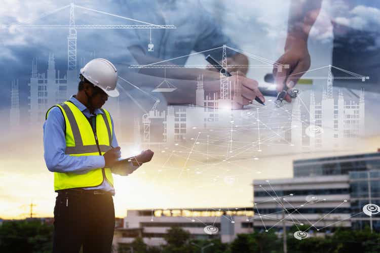 Engineering Consulting People on construction site holding tablet in his hand. Management in business workflow and Building inspector with BIM technology in Construction Project.