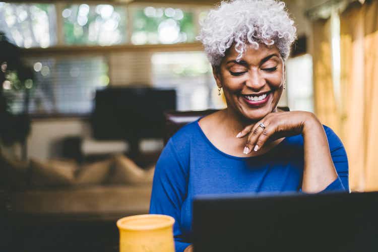 Cheerful woman on video call at home