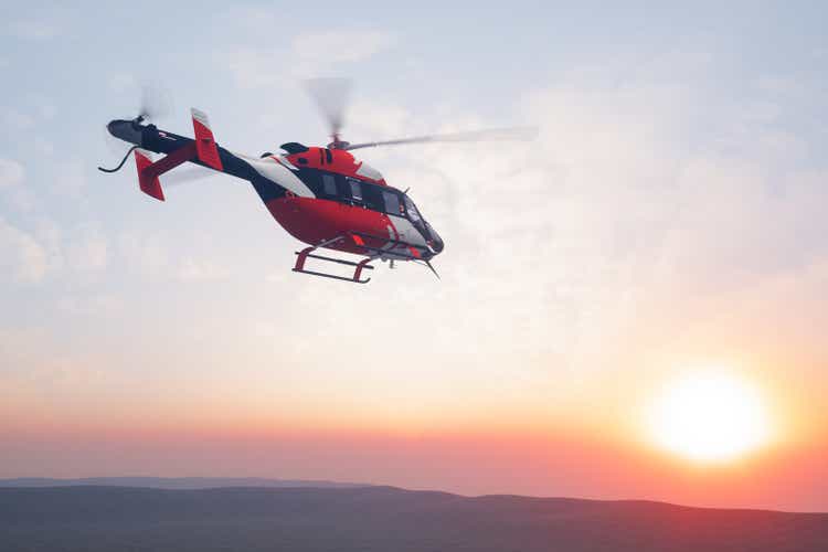 Flying Helicopter At Sunset