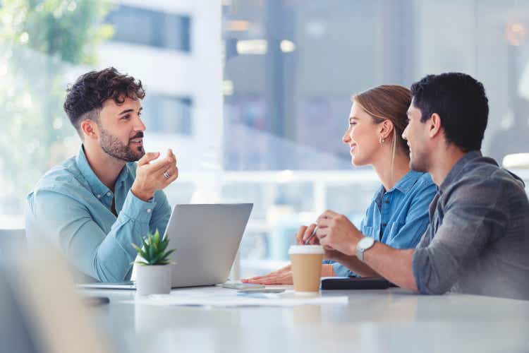 Financial advisor with couple explaining options