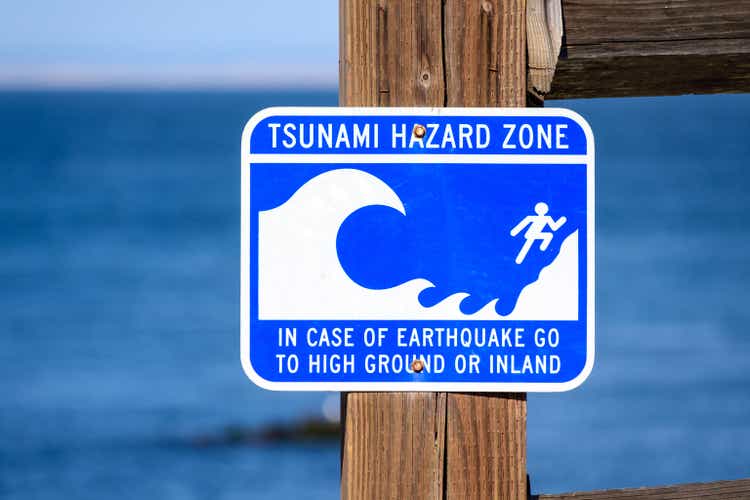 Tsunami Hazard Zone warning sign on ocean coast warn the public about possible danger after an earthquake