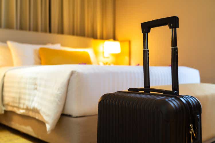 Suitcase delivered standing in hotel room. concept of Hotel service and travel