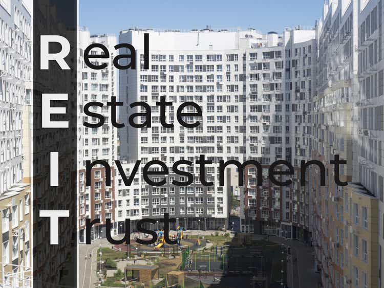 Text Real Estate Investment Trust on new house background