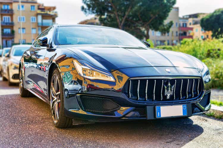 Elegant modern fast and luxury Italian sedan car Maserati Quattroporte in blue navy color produced by Maserati automotive