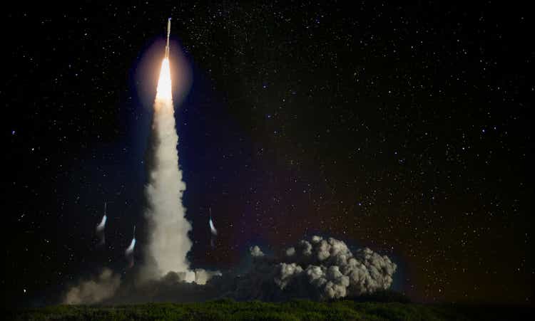 Missile launch at night. Elements of this image furnished by NASA.