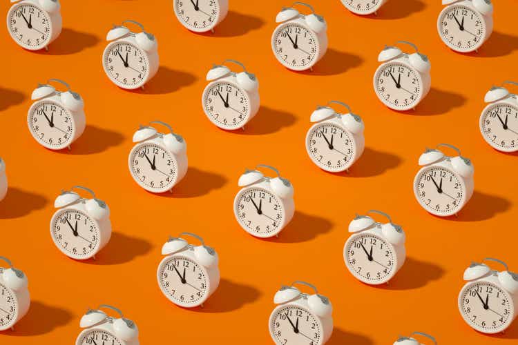 Alarm Clock on Orange Color Background