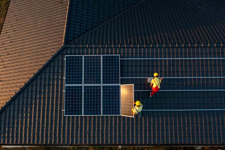 Solar Panel Installation On A Roof Of A House.