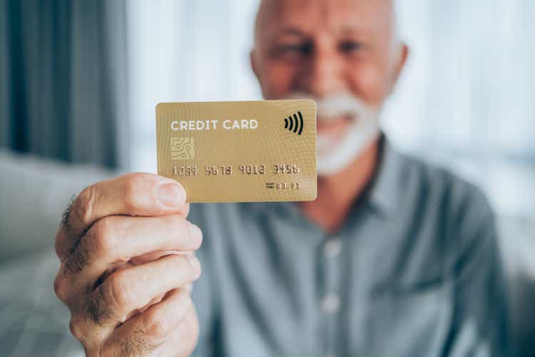 Man holding a credit card.