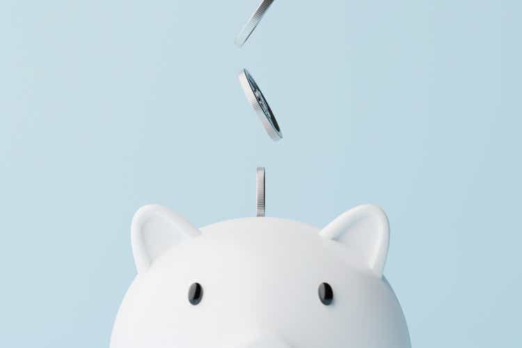 Save money and investment concept. Closeup piggy bank and silver coins falling. 3d rendering illustration