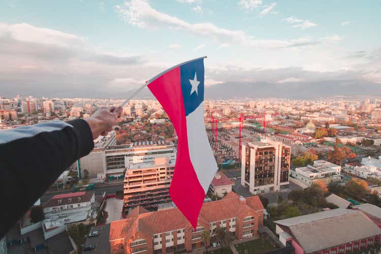 Chile's flag above Santiago city