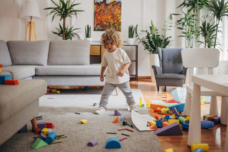 Little boy playing in living room