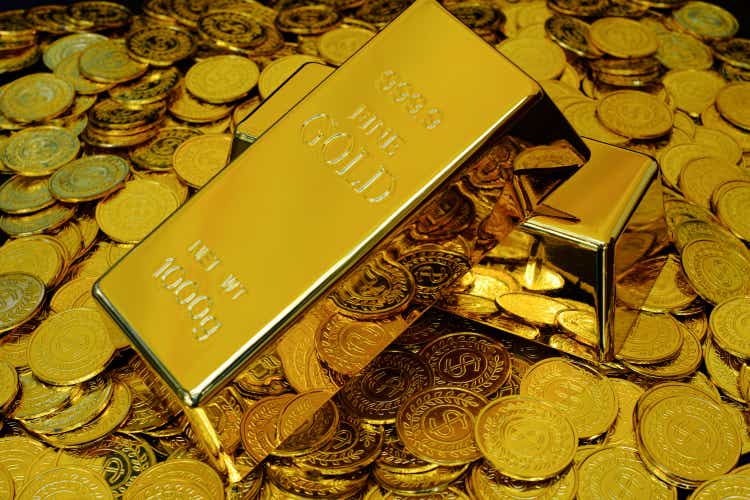 Gold bullion in the stack of many gold coins