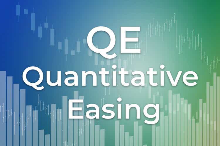 QE - financial term. Monetary policy of quantitative easing by central banks. Text on blue and green finance background