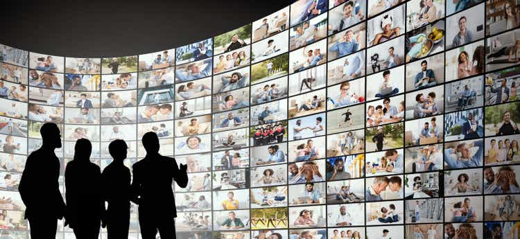 Broadcasting Concept. Digital wall with different channels and people