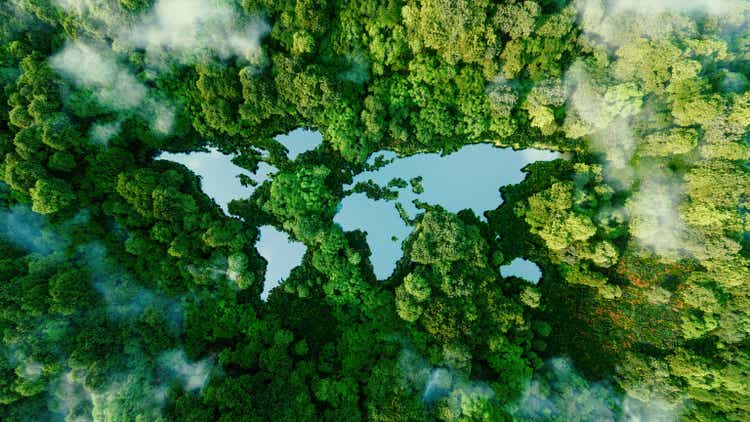 A lake in the shape of the world"s continents in the middle of untouched nature. A metaphor for ecological travel, conservation, climate change, global warming and the fragility of nature.3d rendering