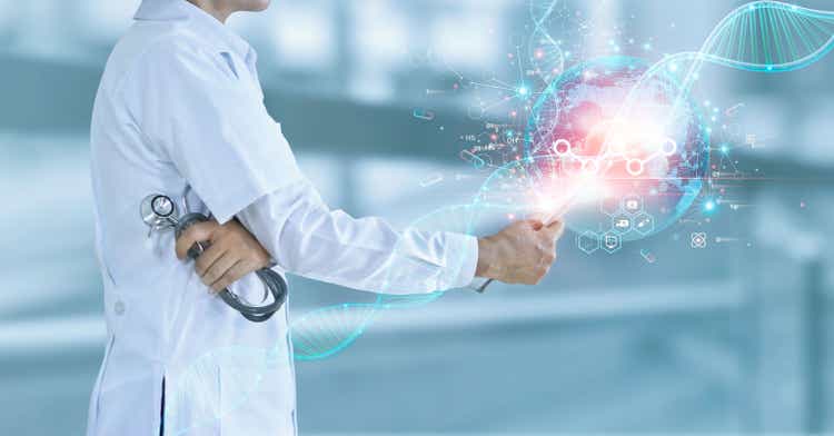 Doctor using tablet on medical interface icon. Digital healthcare and network connection on hologram of electronic medical record. Innovation. Medical healthcare research and development concept