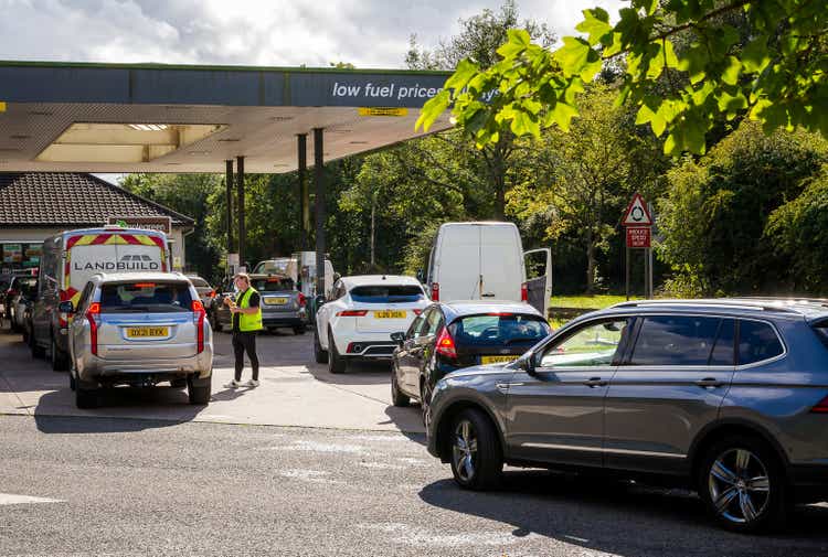 Cars queuing for petrol at gas station due to fuel shortage