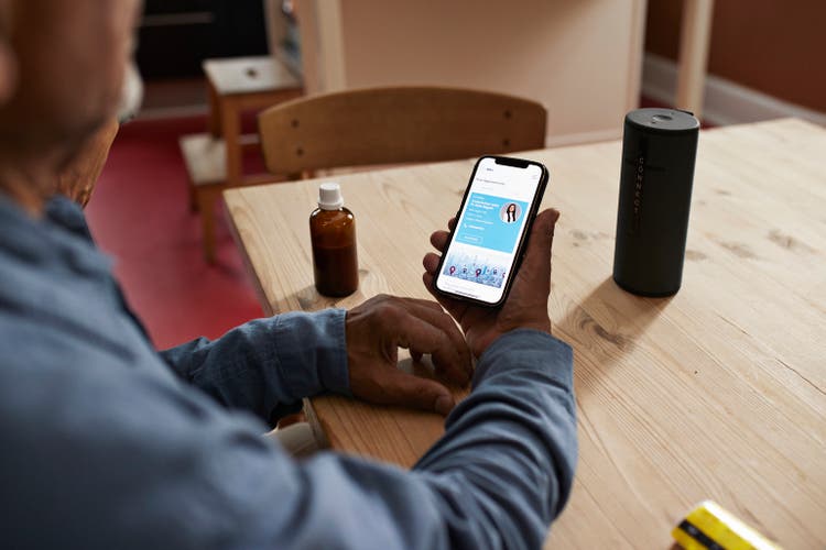 Senior man booking online appointment on smart phone