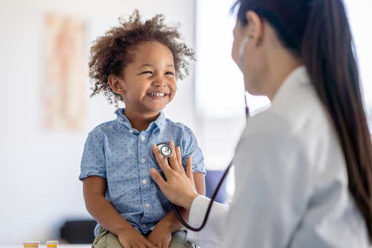 Doctor Listening to Little Boys Heart