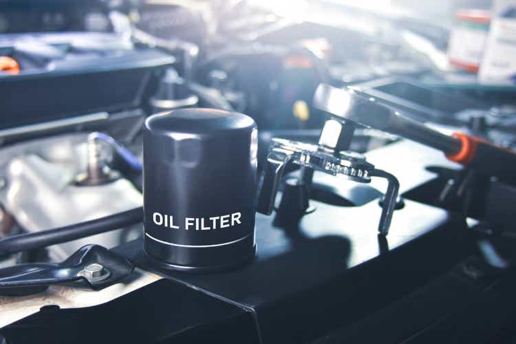 New oil filter of the car for engine oil system maintenance