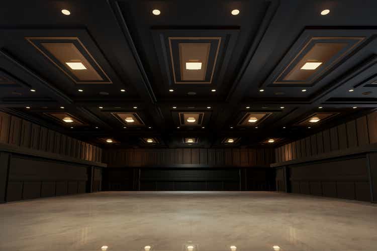 Empty convention hall center with stage.The backdrop for exhibition stands,booth elements. Meeting room for the conference.Big Arena for entertainment,concert,event. ballroom.3d render.