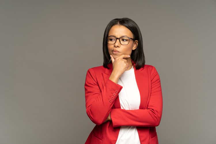 Afro american businesswoman make decision puzzled doubtful thinking pondering on problem solution