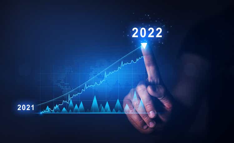 Businessman draws increase arrow graph corporate future growth year 2021 to 2022. Planning,opportunity, challenge and business strategy. New Goals, Plans and Visions for Next Year 2022.