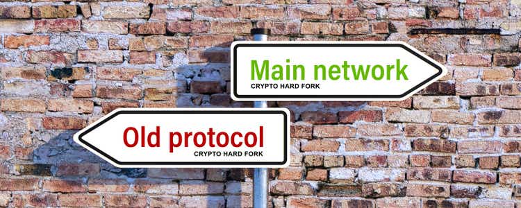 road signs pointing in two directions with the message CRYPTO HARD FORK, MAIN NETWORK and OLD PROTOCOL - 3d illustration