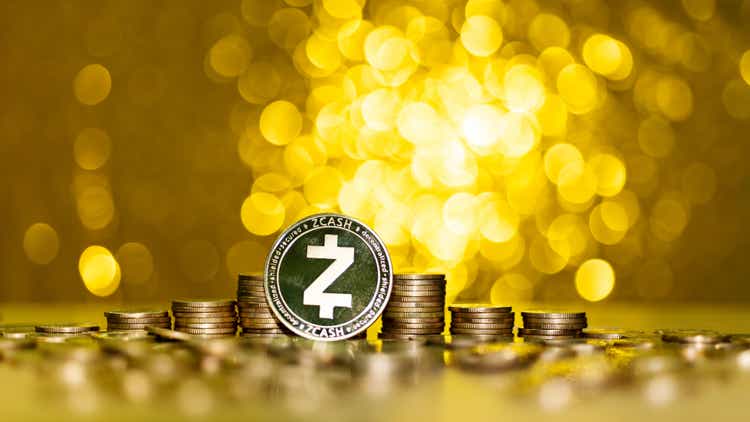 Heap of Zcash coins on shiny golden background