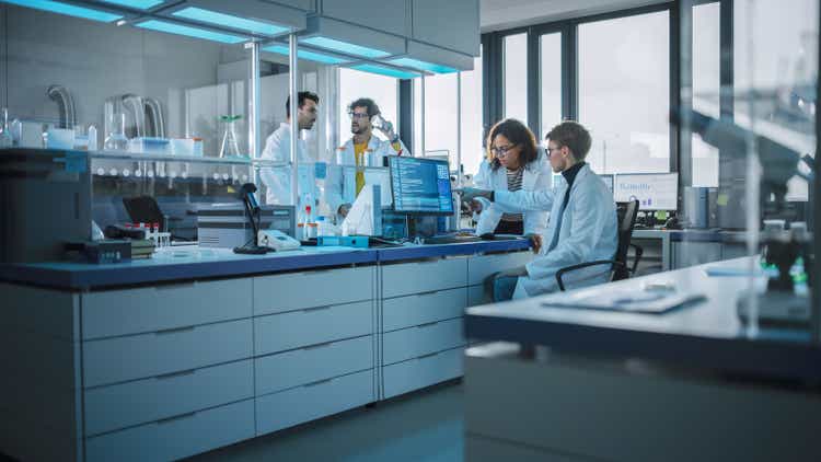 Modern Medicine Research Laboratory: Diverse Team of Multi-Ethnic Young Scientists Analysing Test Samples. Advanced Lab with High-Tech Equipment, Microbiology Researchers Design, Develop Drugs