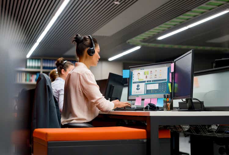 Group of customer service representatives working at a call center