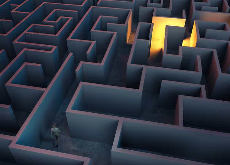 Man walking in a labyrinth . Patience and achieving success concept .