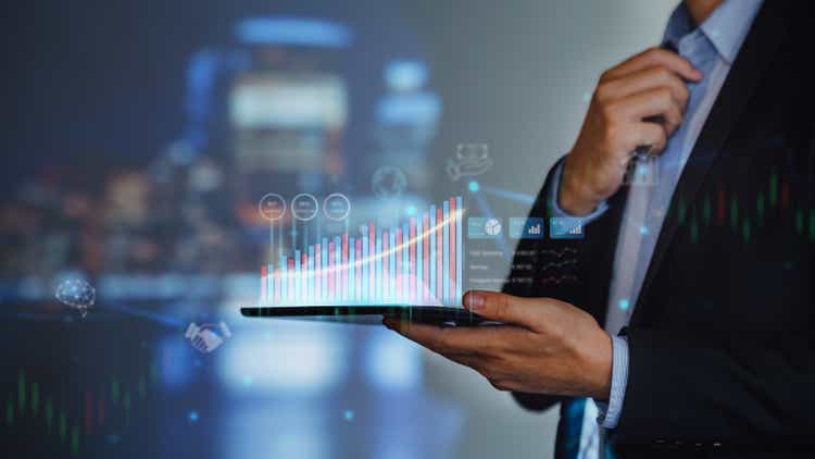 Businessman work with ai for economy analysis financial result by digital augmented reality graph. Concept for entrepreneur leader of invest in business and digital marketing technology of the future.