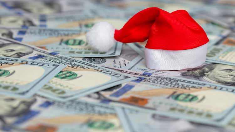 Santa hat on heap of US dollars