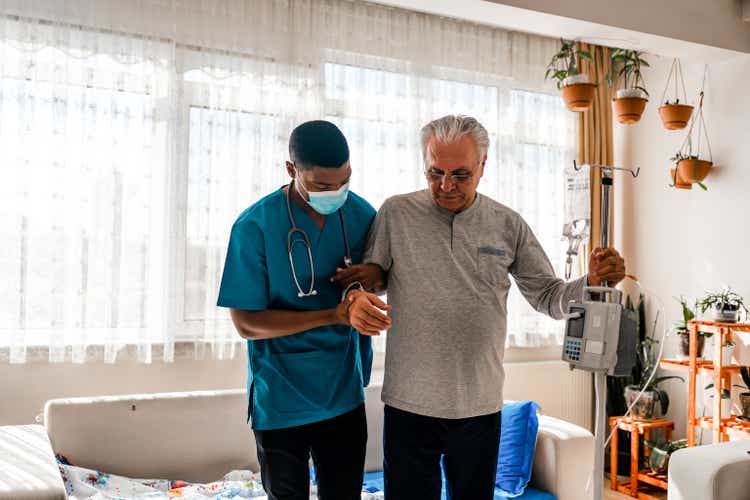 Health visitor and a man during home visit