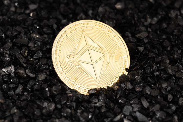Ethereum classic coin on black gravel background