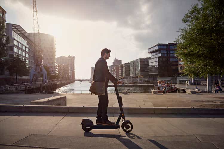 Young man on e-scooter in the city