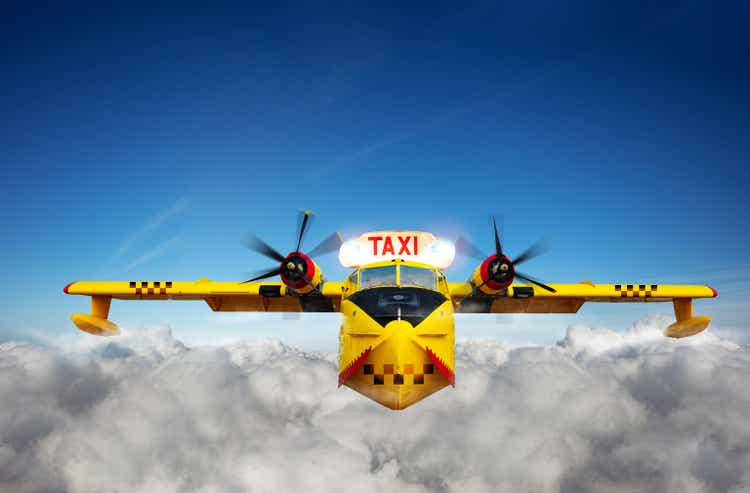 Yellow air taxi airplane transportation in sky