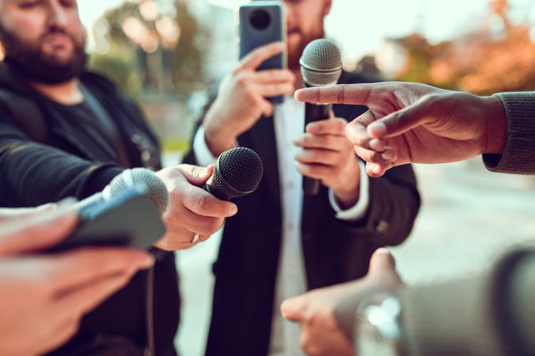 African Male Pointing While Giving Statement For Journalists Outside