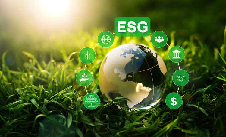 Crystal globe and ESG icons on green background.Environment social and governance in sustainable and ethical business.Using technology of renewable resource to reduce pollution