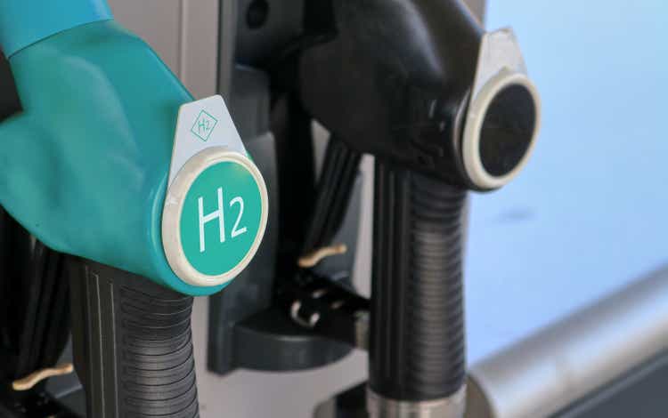 Hydrogen logo on gas stations fuel dispenser. Concept for emission free eco friendly transportation. Green energy. Fuel filler nozzle to fill hydrogen powered vehicles