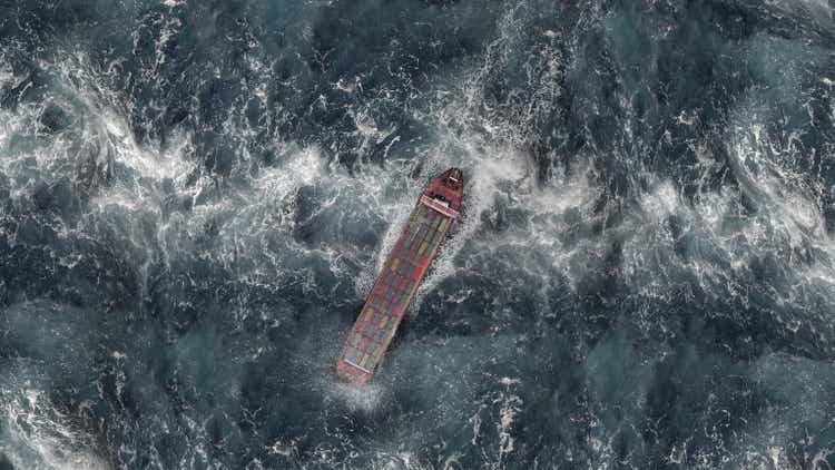 Large Cargo Ship with containers in stormy ocean,aerial