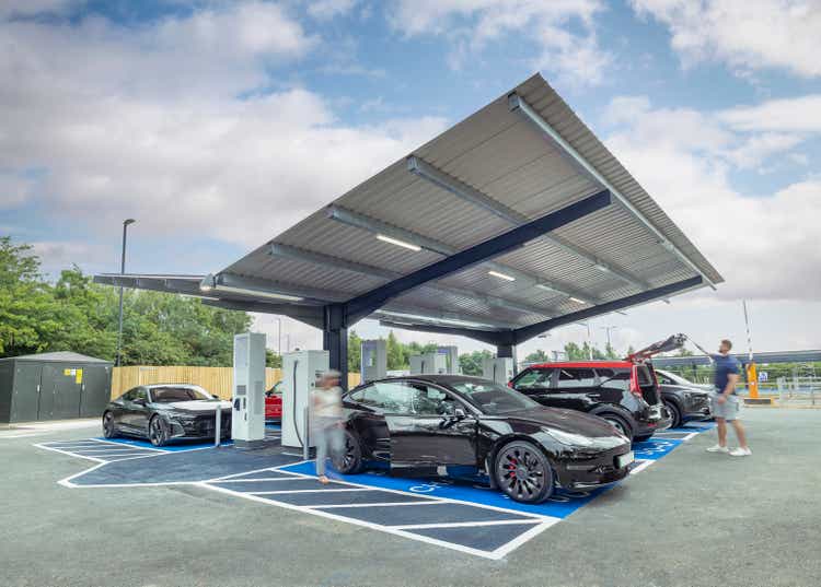 UK, York, People charging their electric cars at charging station