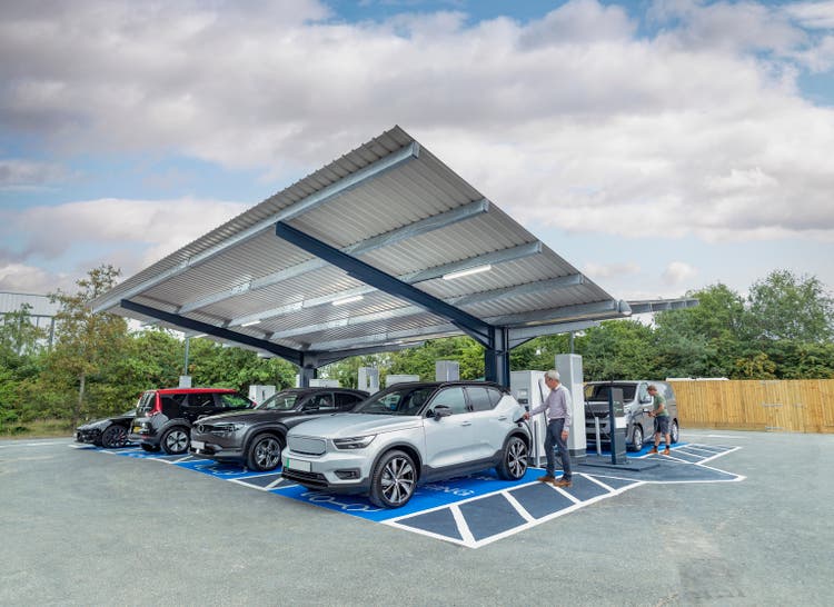UK, York, People charging their electric cars at charging station