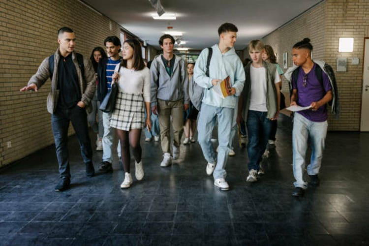 High School Students Walking Down Corridor