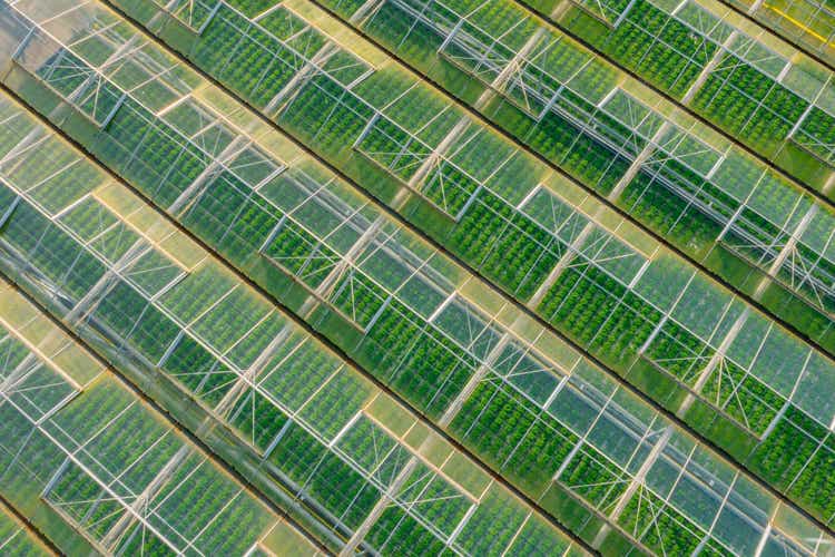 Drone view onto a row of greenhouses