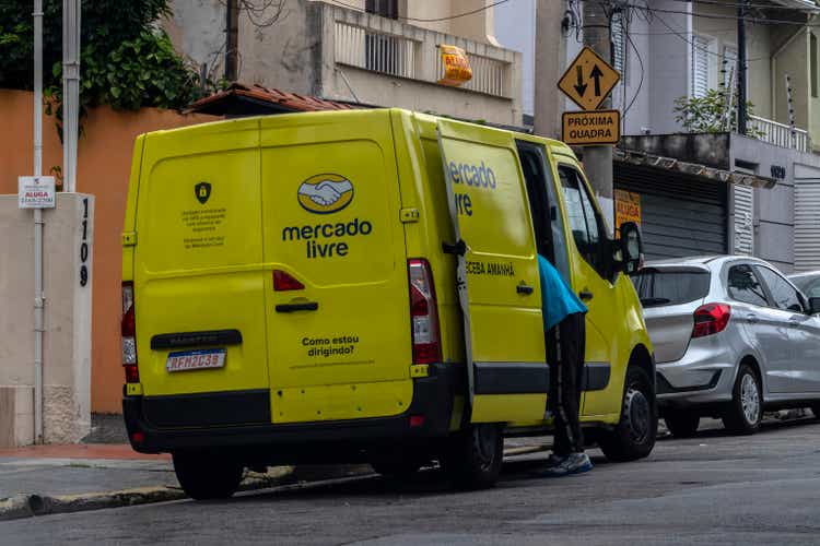 Yellow Mercado Livre delivery van parked in the street of Sao Paulo