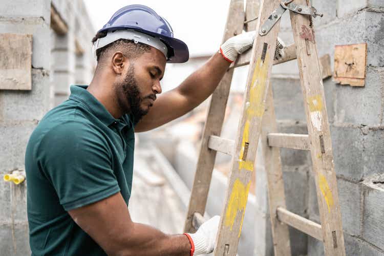 Tired construction worker in a construction site