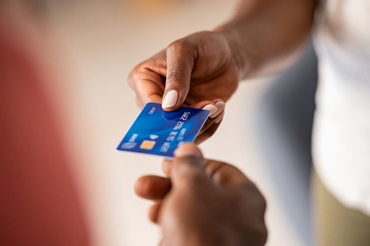 Black woman paying with credit card