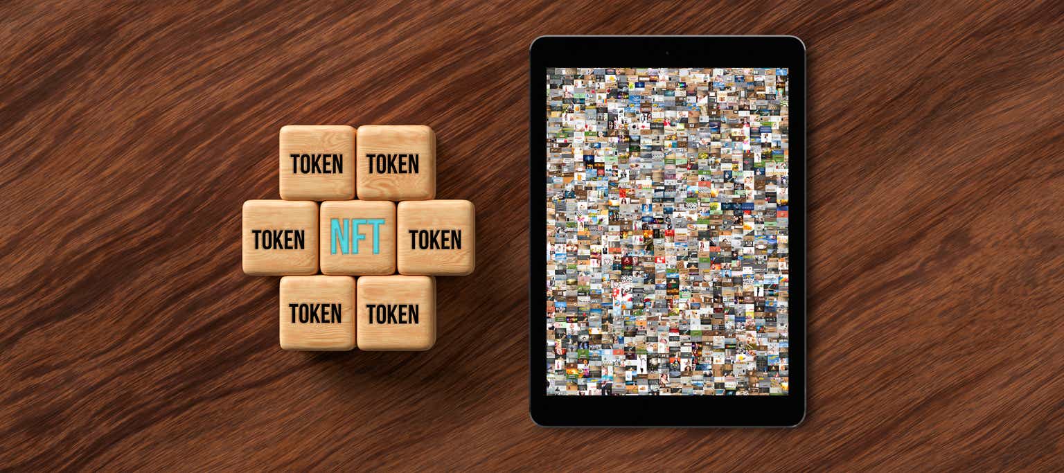 cubes with message NFT and TOKEN on wooden background